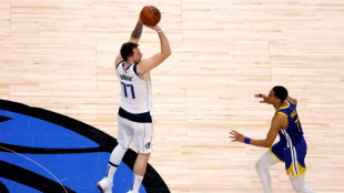 Doncic helps Mavs down Warriors to keep series alive