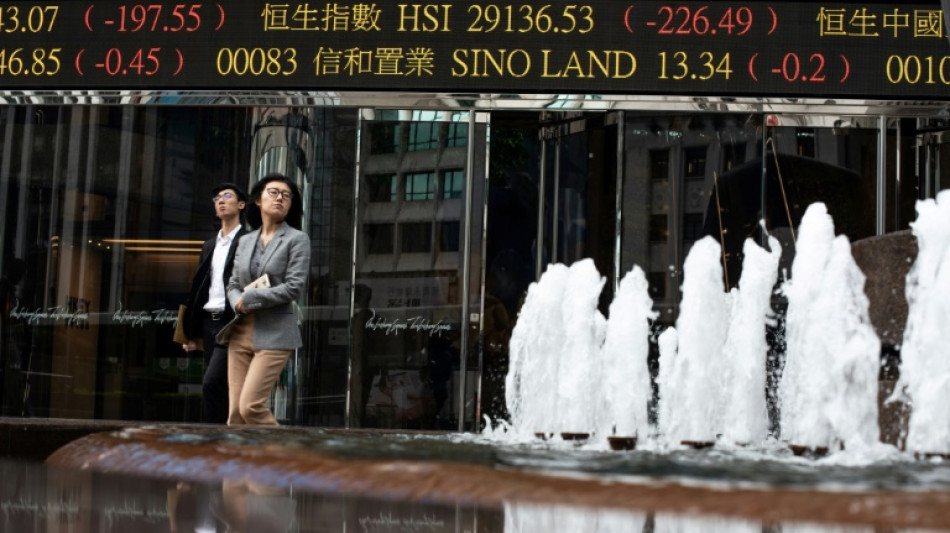 Asian traders take breather, Hong Kong slips after huge surge