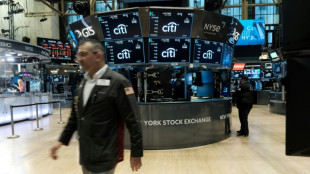 Wall Street termine en baisse, redoute un durcissement de la Fed 