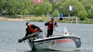 Deminers race to clear lake favoured by bathers near Kyiv