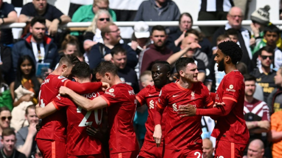 Man City keep Liverpool at arm's length, Norwich relegated