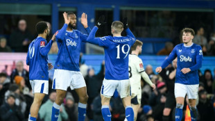 Everton advance in FA Cup after Dyche dismissal