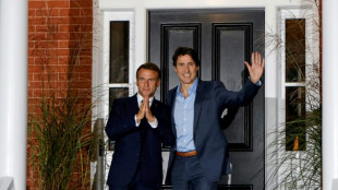 Macron meets Trudeau in Canada as both face political setbacks