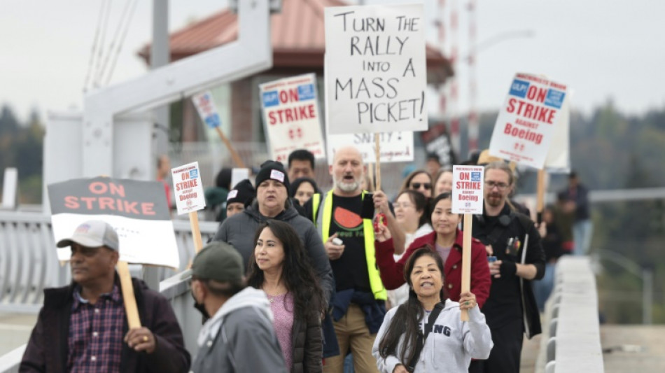 Striking workers weigh latest Boeing contract offer