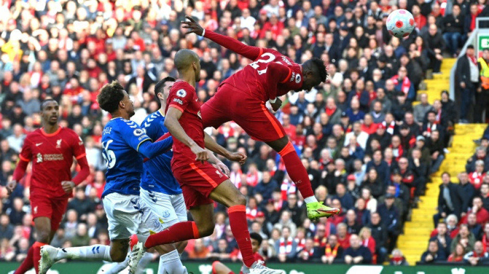 Liverpool overcome Everton battle to keep pressure on Man City