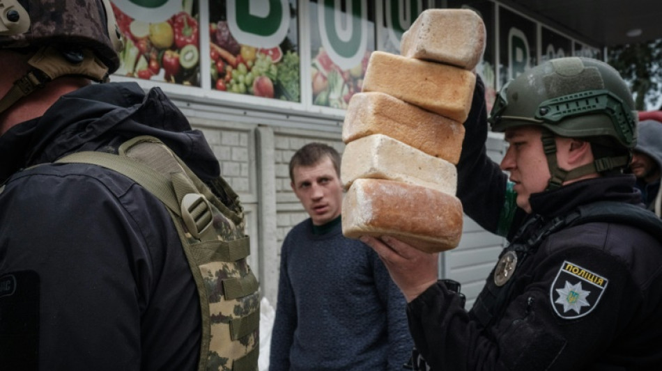 Frenzied aid run in Ukrainian town amid Russian bombs