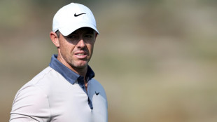 Hillier holds narrow Dubai lead as McIlroy eyes final-round surge