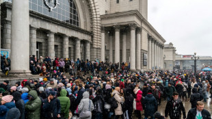 Displaced Ukrainians pack trains to western border