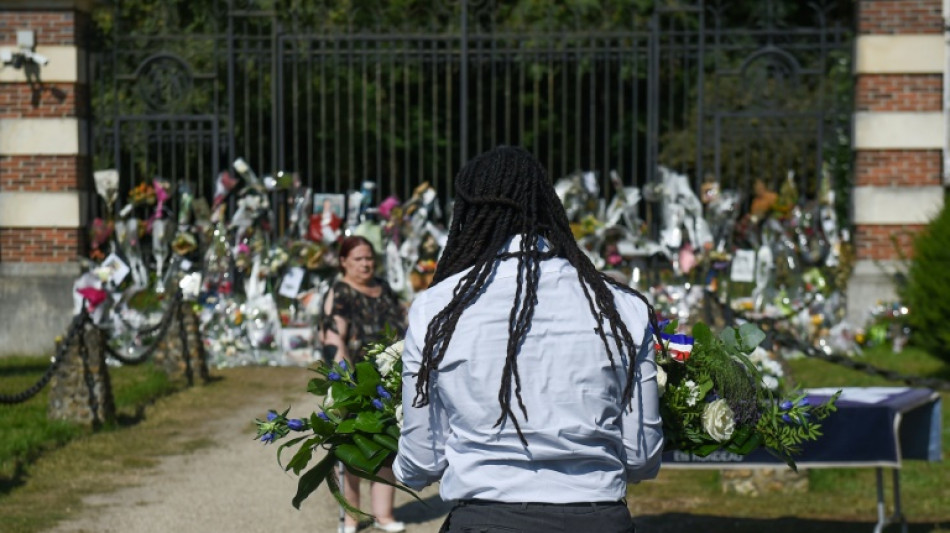 Film legend Delon is buried near his dogs as fans mourn